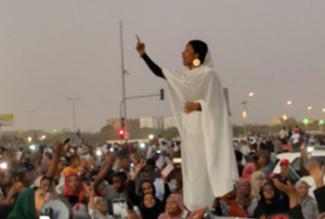 Iconic photo of Alaa Salah, a Sudanese woman protestor leading the uprising against Former President Al-Bashir